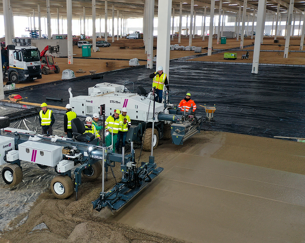 Somero employees working, concrete machinery