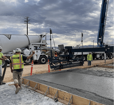 Trucks, man with machines. Road in constructions.