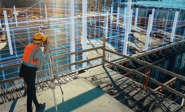 Job site with construction worker and CAD overlay